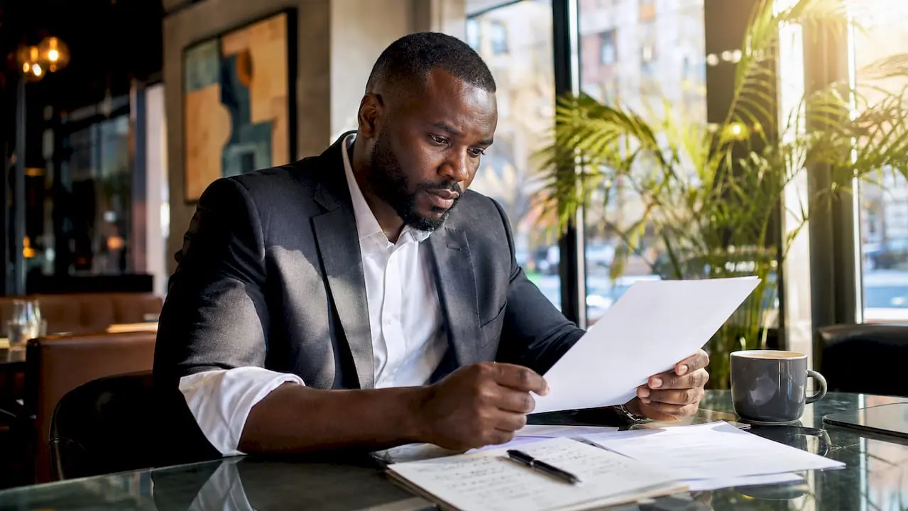 Security professional reviewing job offer letter