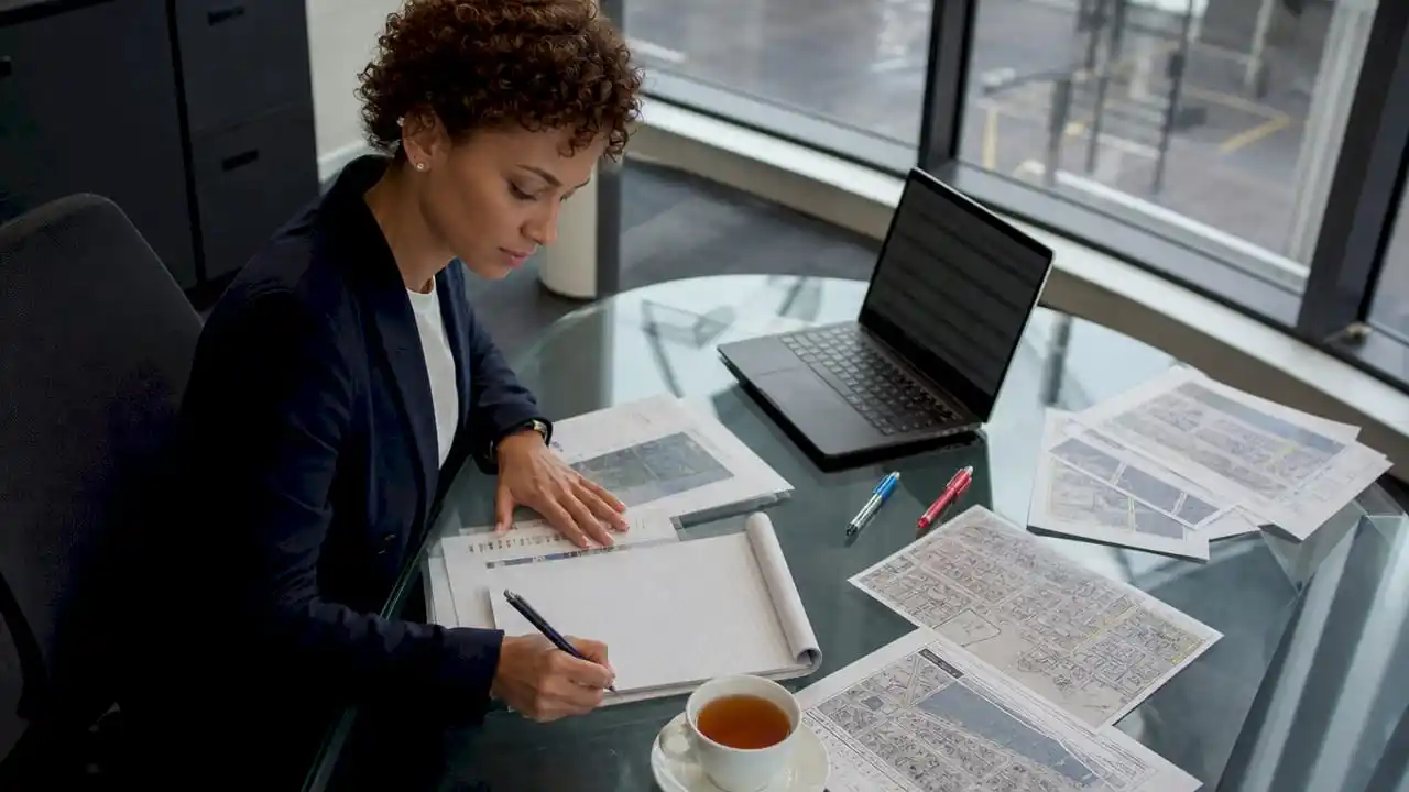 Female coordinator preparing security site briefing notes