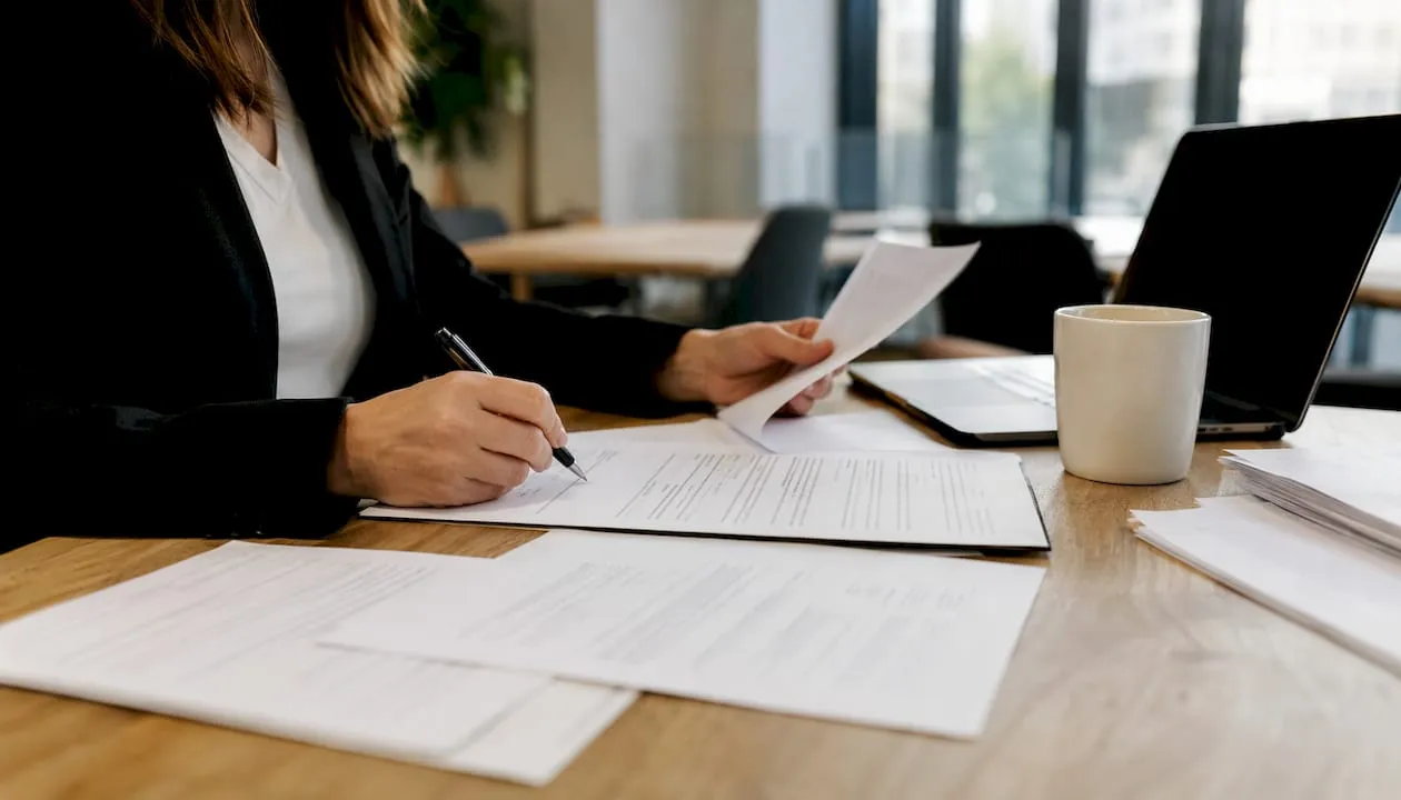 HR manager hands reviewing UK hiring documents