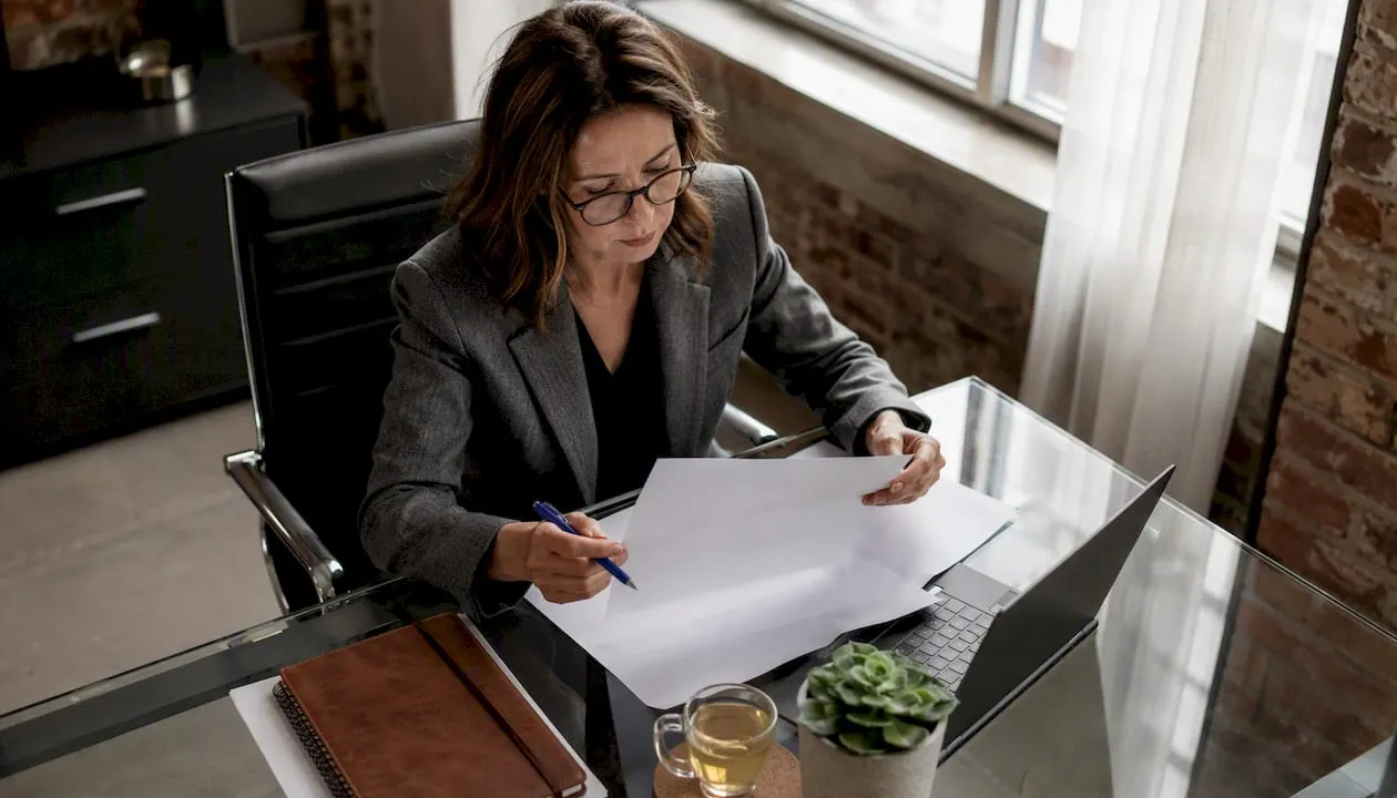 UK hiring manager reviewing job description drafts