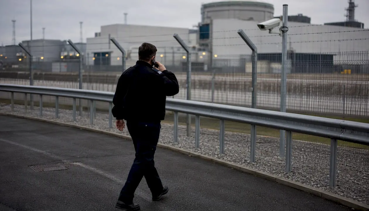 UK security officer patrolling industrial site