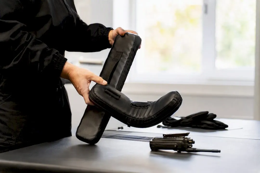 Hands handling security training equipment