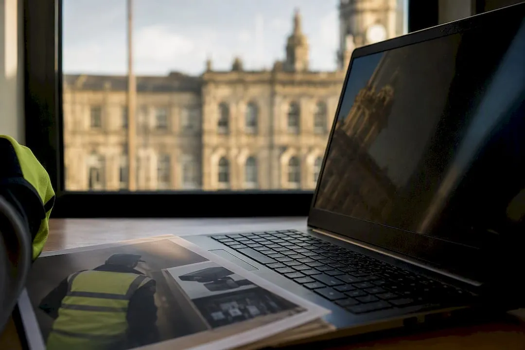 Keyboard and monitor with UK government building reflection