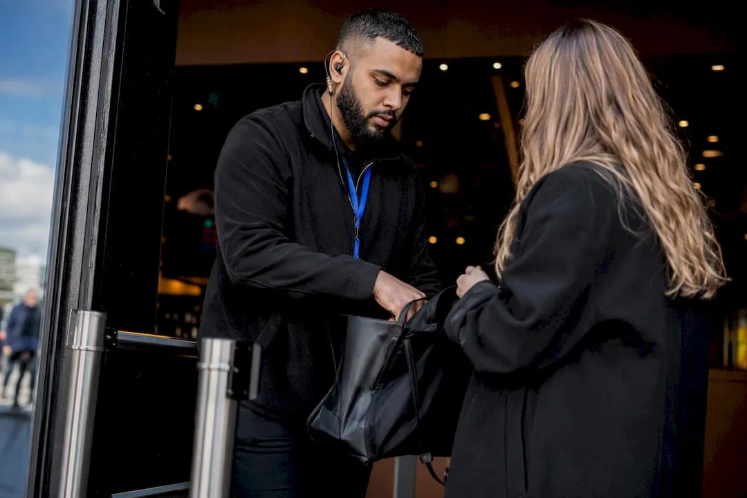 UK security steward checking venue entry
