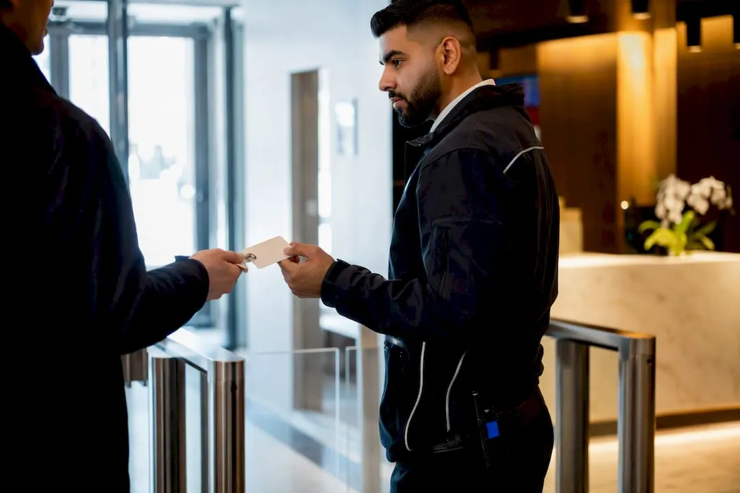UK security officer checking access badge