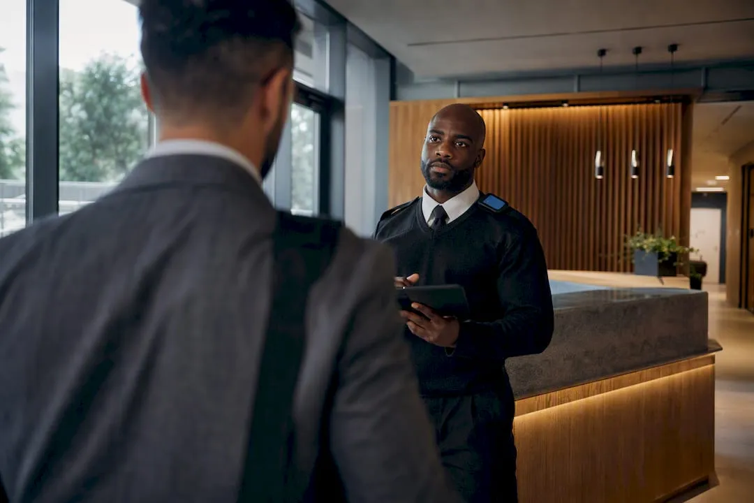 UK guard verifying an unfamiliar visitor
