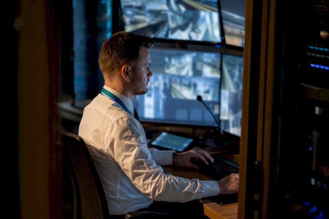 UK CCTV operator reviewing networked camera feeds